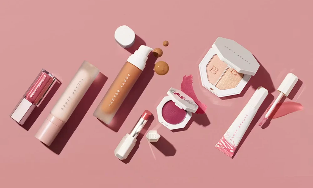 | Fenty Beauty: The Complete Guide to Rihanna's $2.8 Billion Beauty Empire (2025) Fenty Beauty cosmetics displayed on minimal concrete stone blocks against a clean background