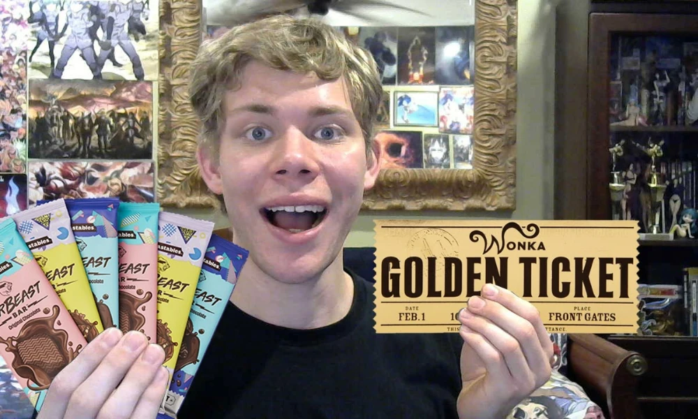 | Feastables: MrBeast's $250M Chocolate Empire & Why It's More Profitable Than YouTube An excited fan holding a replica Wonka Golden Ticket alongside a selection of Feastables bars