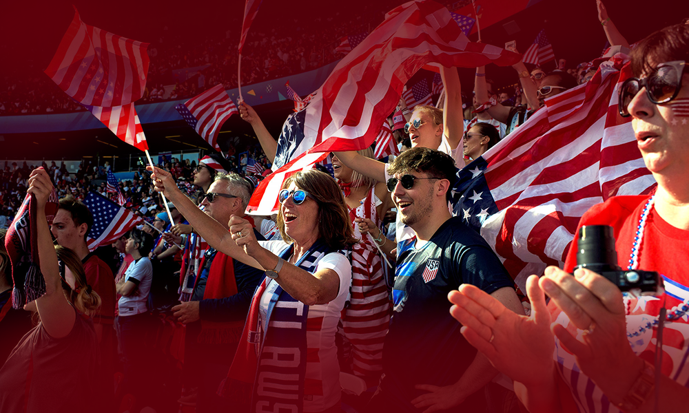 | When Is USA's Next World Cup Game? USMNT Round of 32 Schedule USA soccer fans cheering in the stadium with American flags during a match, showing fan enthusiasm for the national team.