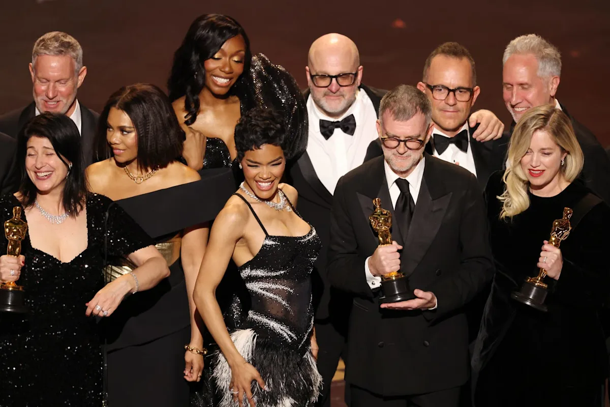| Oscars Winners 2026: The Big Movie Awards Show Explained Michael B. Jordan holding his first-ever Best Actor Oscar trophy behind the gold Oscars sign