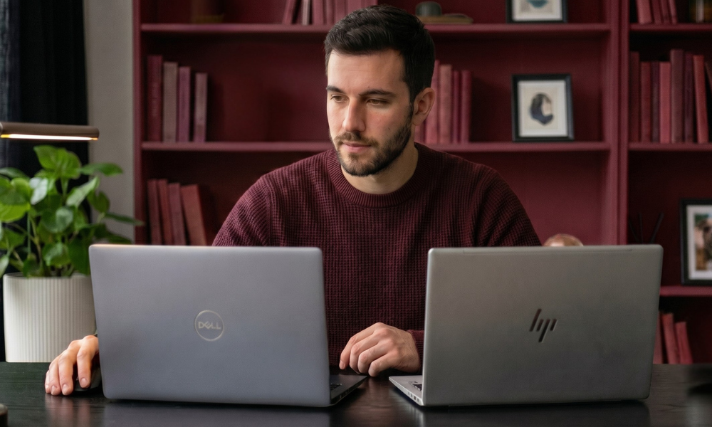 | Dell vs HP Laptops: Which One Gives the Best Value for Work & Study in 2026? Sleek display angle comparison of an HP thin profile laptop and a durable Dell professional laptop