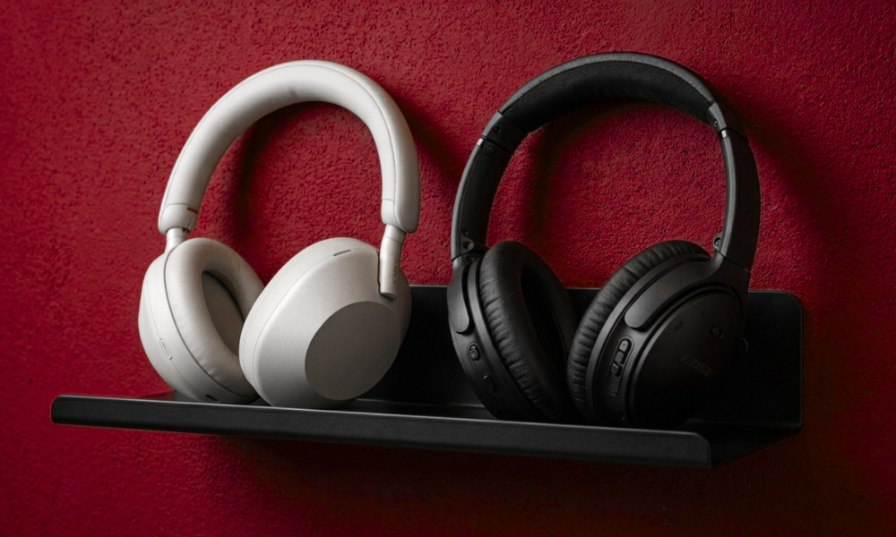| Bose vs Sony Headphones: Which Is Better in 2026? Sony vs Bose premium personal audio headphone brand rivalry text logo display on a red gradient background