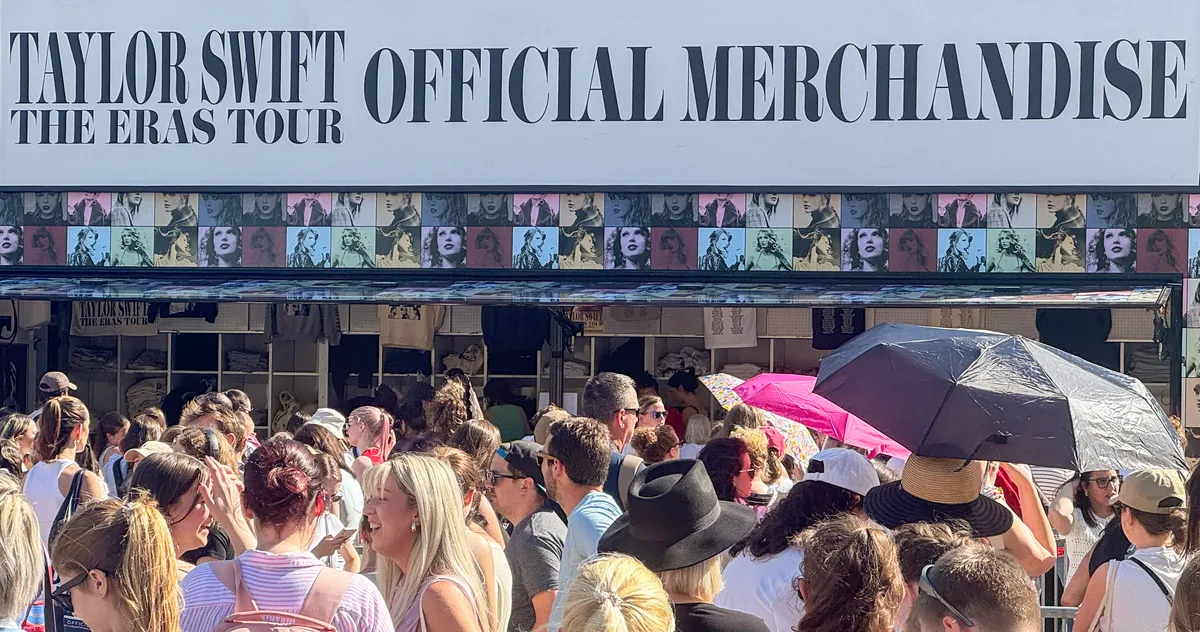 | Taylor Swift Merchandise: Revenue Model, Earnings & Why It's A Billion-Dollar Business Taylor Swift presenting official Eras Tour collectors cups and thematic popcorn buckets merchandise