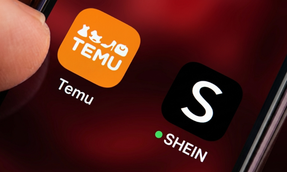 | Zara vs. H&M: Fast Fashion's Digital Marketing Duel, Who Owns the Feed in 2026? Mobile smartphone screen displaying app store icons for discount e-commerce marketplace giants Temu and Shein