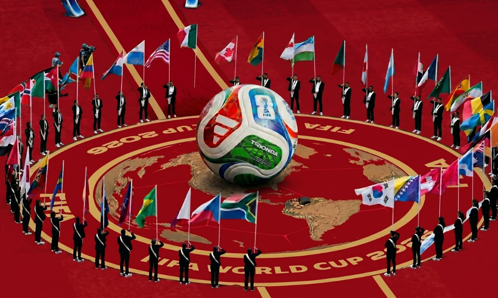 | FIFA World Cup 2026 Marketing: How Brands Are Winning the Summer of Soccer A stadium opening ceremony center stage featuring a large tournament soccer ball surrounded by global flags on a red circular layout