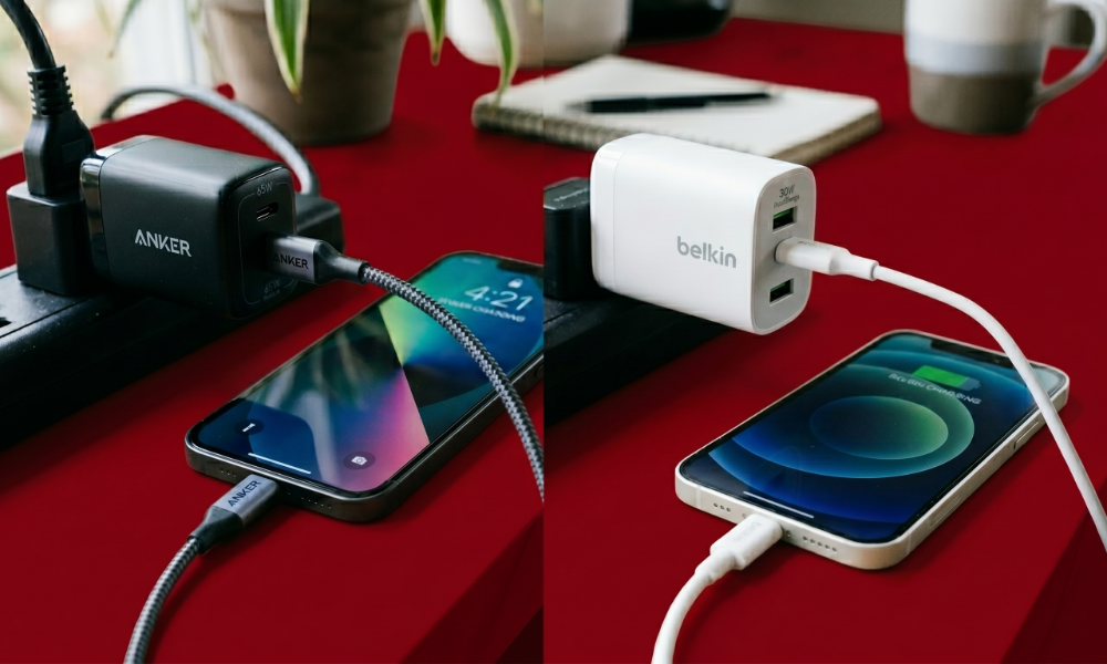 | Anker vs Belkin — The Best Accessories Brand You're Probably Ignoring A comparison review tracking a high wattage Anker GaN charger block next to a certified white Belkin wall adapter on a red office desk