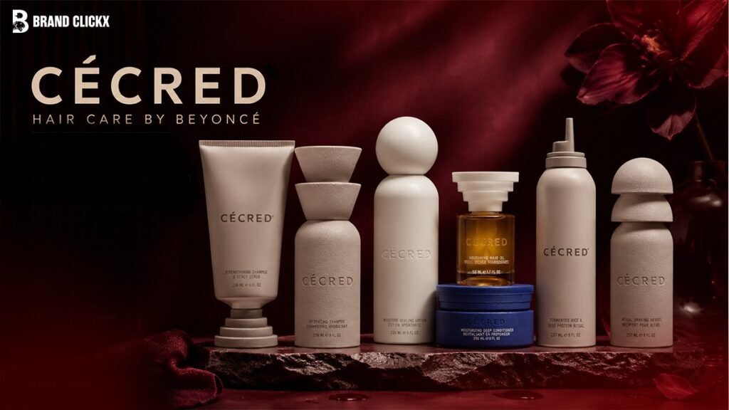 cecred-hair-care-by-beyonce-complete-foundation-lineup The official Cécred hair care by Beyoncé product lineup displayed neatly on a dark stone slab platform under deep red ambient lighting