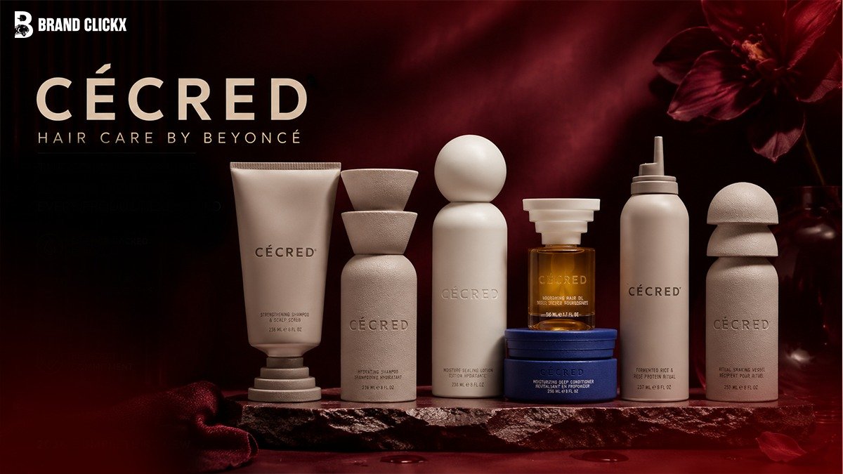 cecred-hair-care-by-beyonce-complete-foundation-lineup The official Cécred hair care by Beyoncé product lineup displayed neatly on a dark stone slab platform under deep red ambient lighting