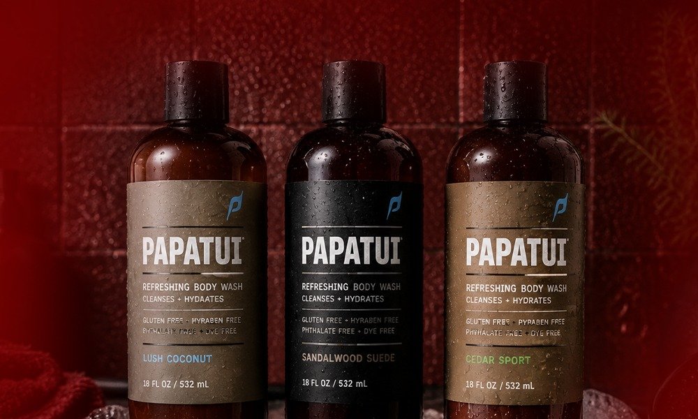 | Papatui Review: Testing Dwayne "The Rock" Johnson's Men's Care Brand Three bottles of Papatui Refreshing Body Wash covered in water droplets showing Lush Coconut, Sandalwood Suede, and Cedar Sport variants