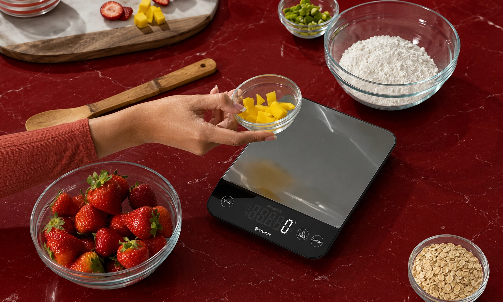 A smart kitchen scale being used with bowls of ingredients on a kitchen counter.