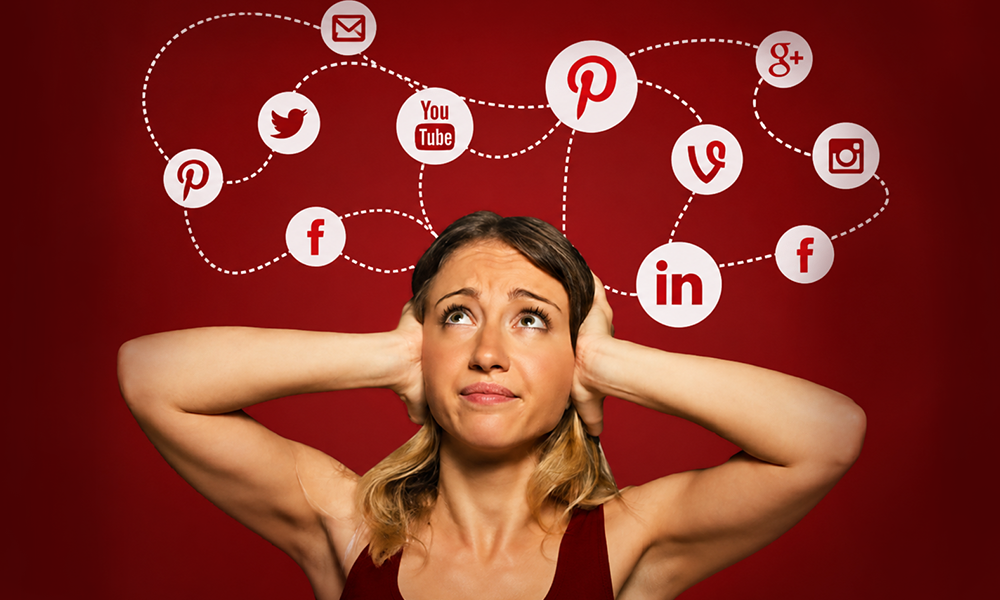 Girl looking into mobile screen surrounded by floating like icons