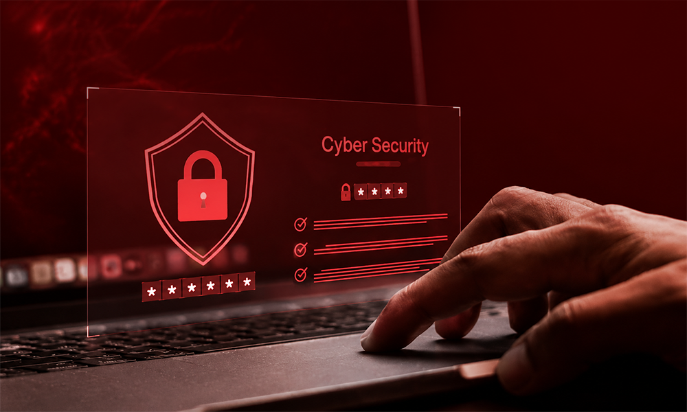 | 6 Lesser-Known Tech Brands Crushing It in Cybersecurity Person working on a laptop with a digital lock icon for cybersecurity