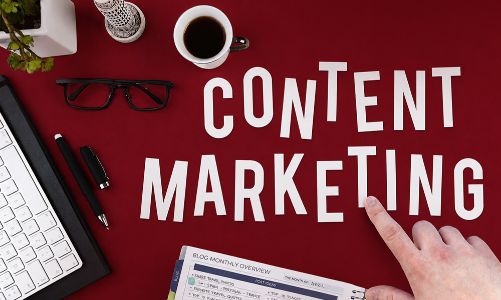 Content marketing planning flatlay with notes and coffee by Brand ClickX.