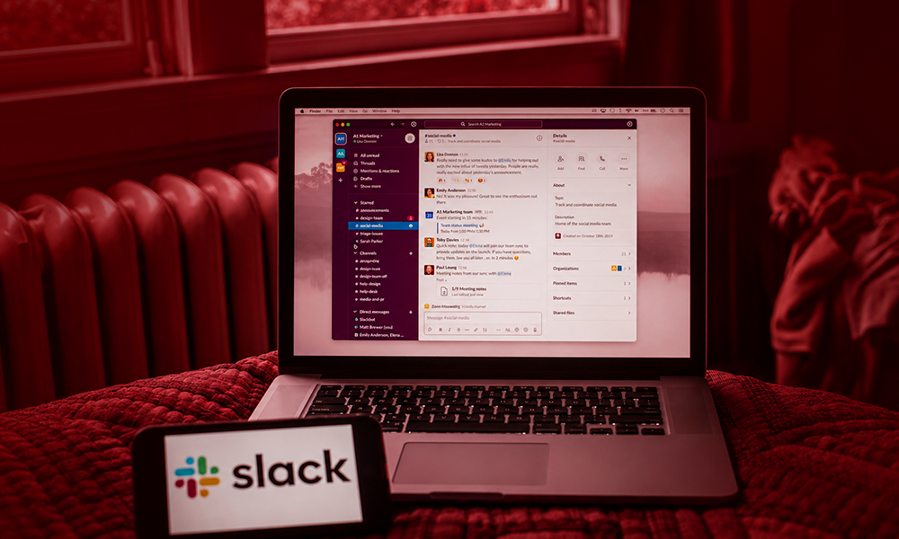Laptop and smartphone displaying the Slack application