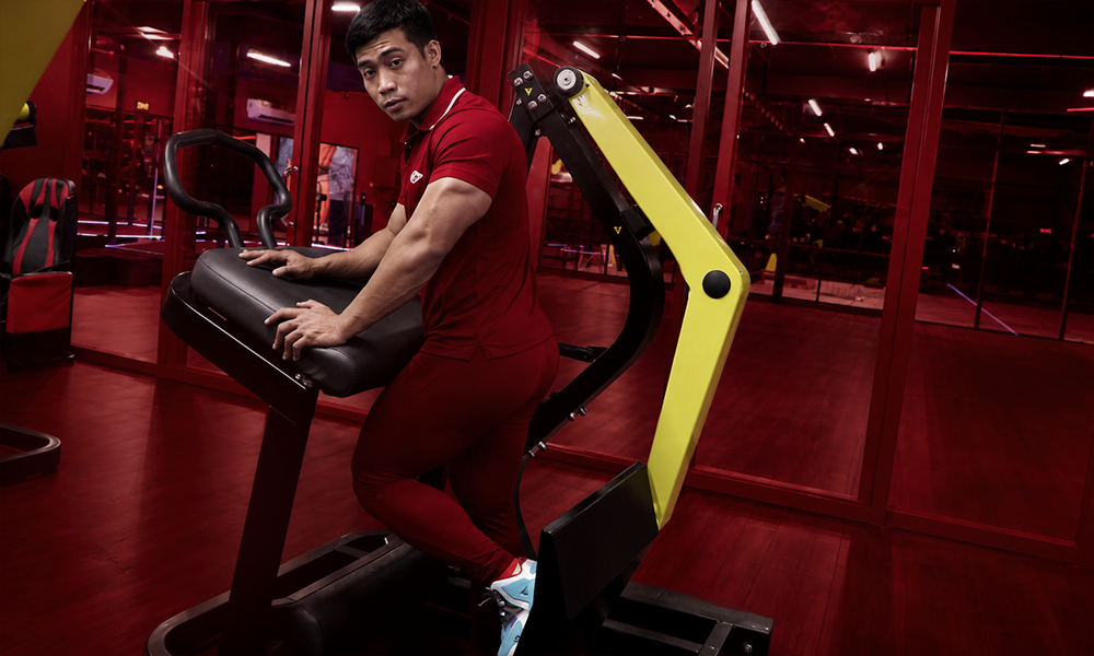 Close-up of lower body performing leg press exercises by Brand ClickX.