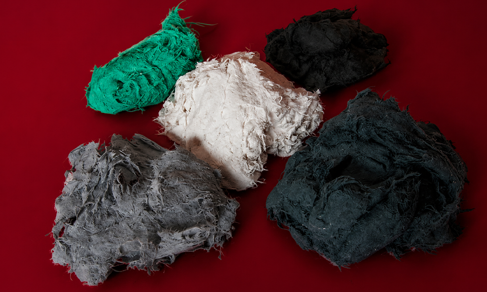 Assorted raw clay pieces arranged on a deep red background by Brand ClickX.
