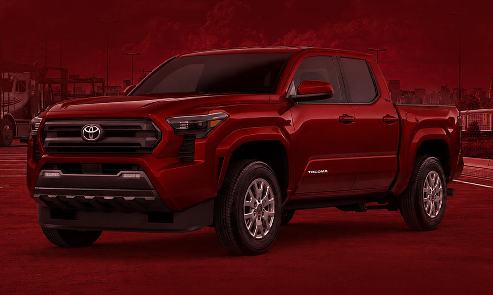 | Toyota Tacoma 2026: Complete Buyer’s Guide A red pickup truck shown in a professional studio setting.