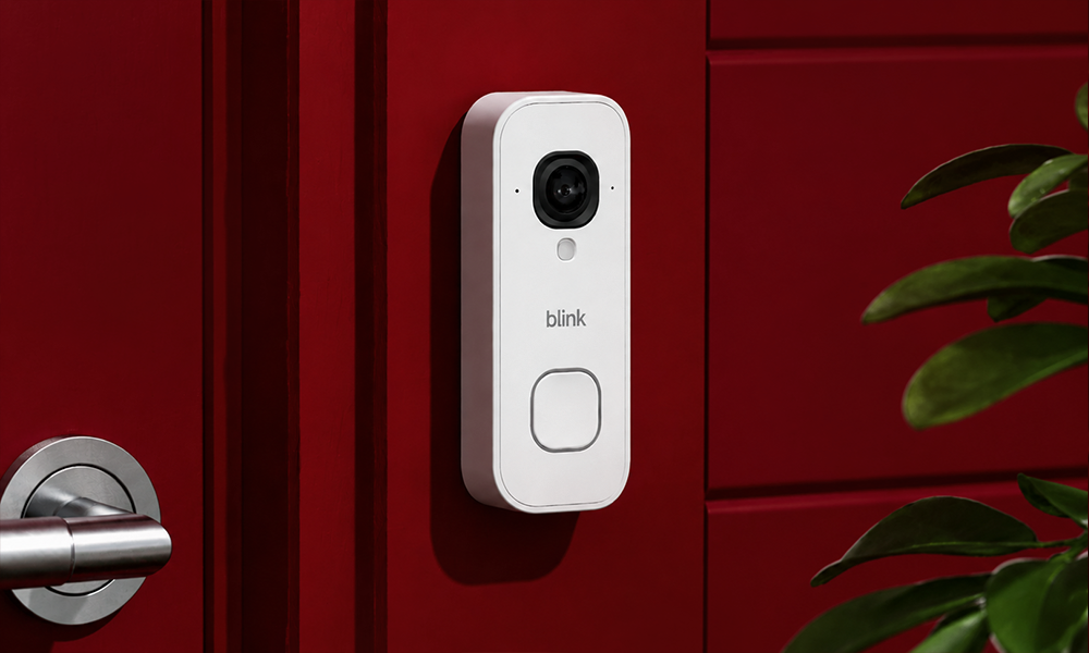 | 15 Best Video Doorbells Compared A sleek white smart video doorbell mounted cleanly next to a wooden front door and green foliage