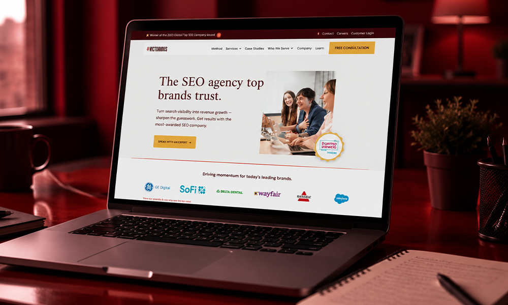 Laptop displaying the homepage of the Victorious SEO agency website.
