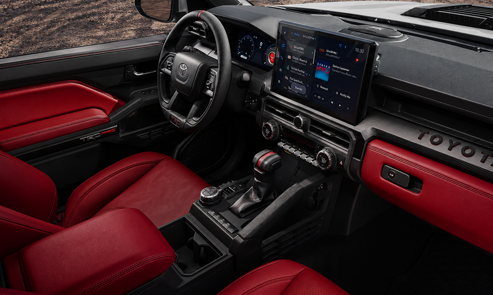 | Toyota Tacoma 2026: Complete Buyer’s Guide Interior view of a pickup truck, focusing on the dashboard.