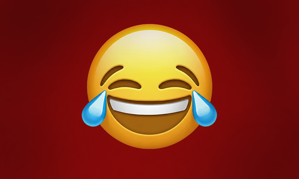 A large laughing emoji icon against a deep red background.