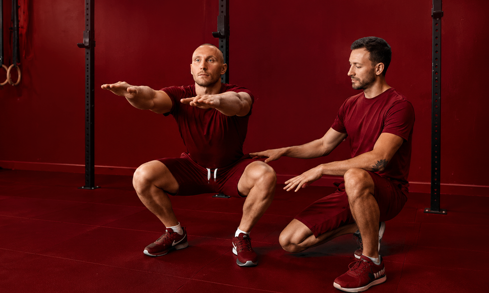 Two trainers demonstrating proper form and positioning by Brand ClickX.