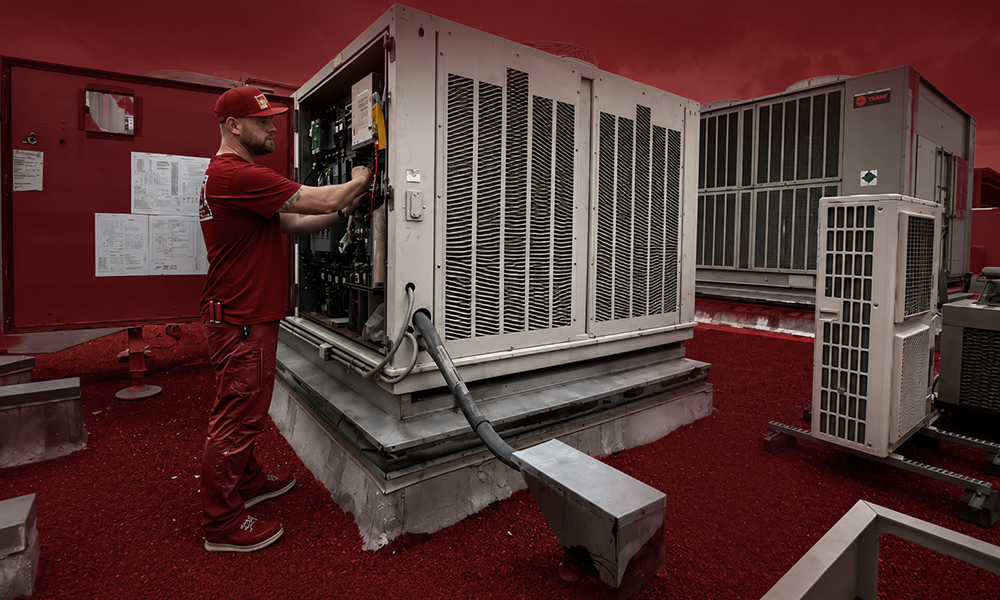Technician performing service on an HVAC system.