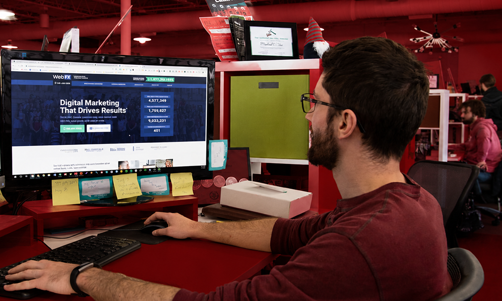| Google Ads Agency: 20+ Best Google Ads Agencies for PPC Campaigns An SEO specialist working at a computer desk, analyzing performance data.