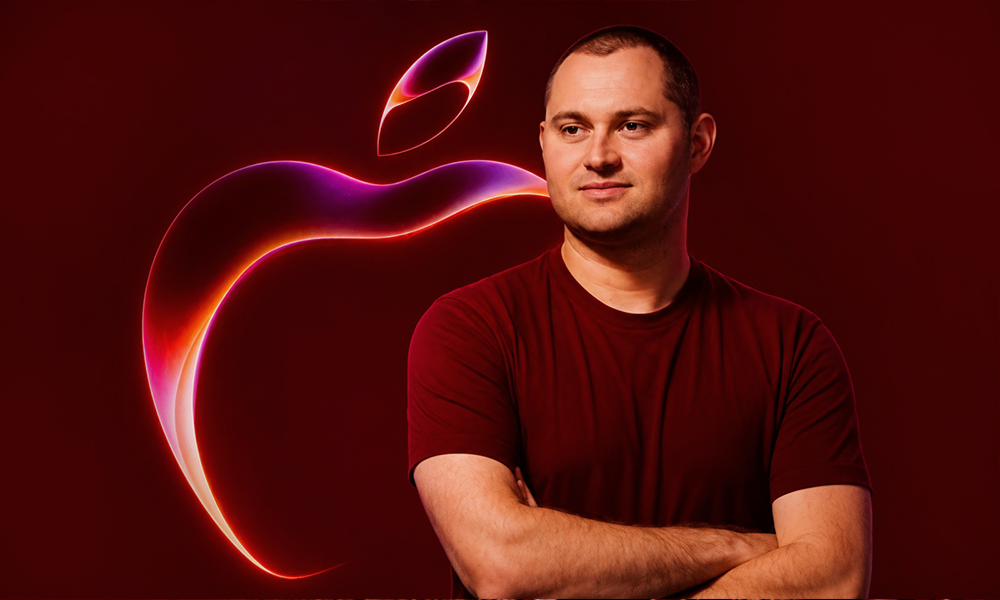 A portrait of a professional against a matching red background.