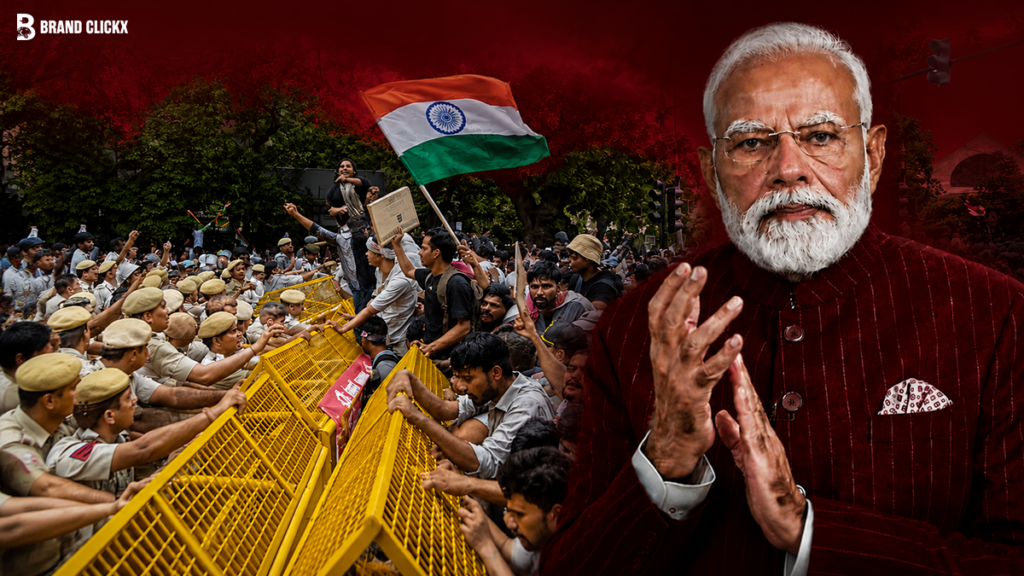 Indian Prime Minister Narendra Modi with a crowd protesting and security forces behind yellow barricades holding the Indian flag