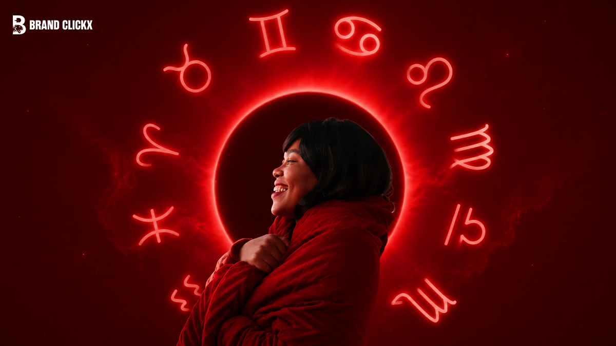 astrology-signs-red-background A smiling woman wrapped in a red blanket surrounded by glowing red zodiac signs and the Brand ClickX logo.