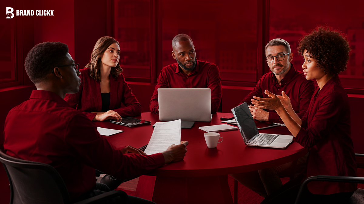 A diverse team collaborating in a professional meeting around a table.