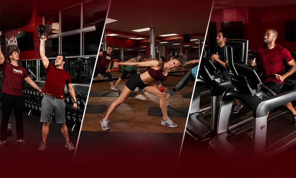 Group fitness class exercising in a red-themed gym environment