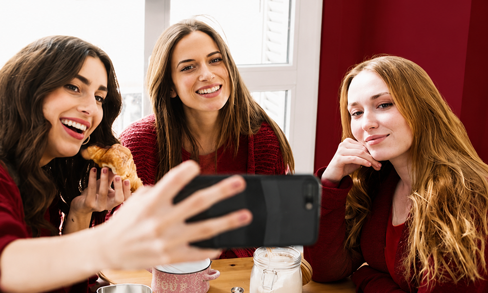Female creator showcasing branding comments on tablet screen