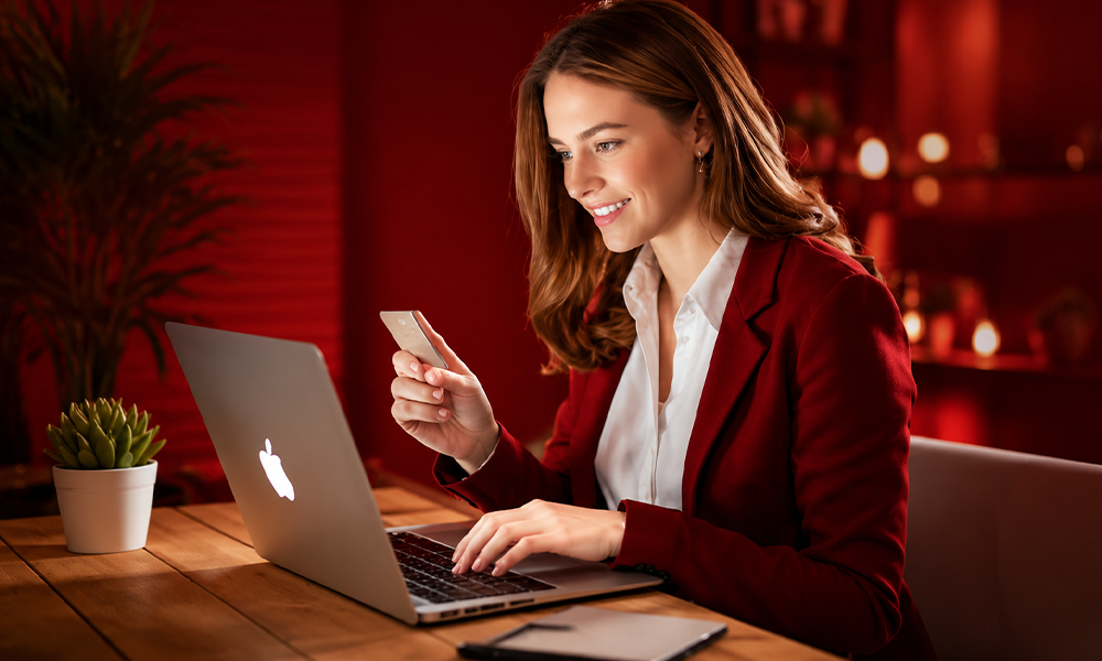 Professional woman analyzing digital creator marketing on laptop