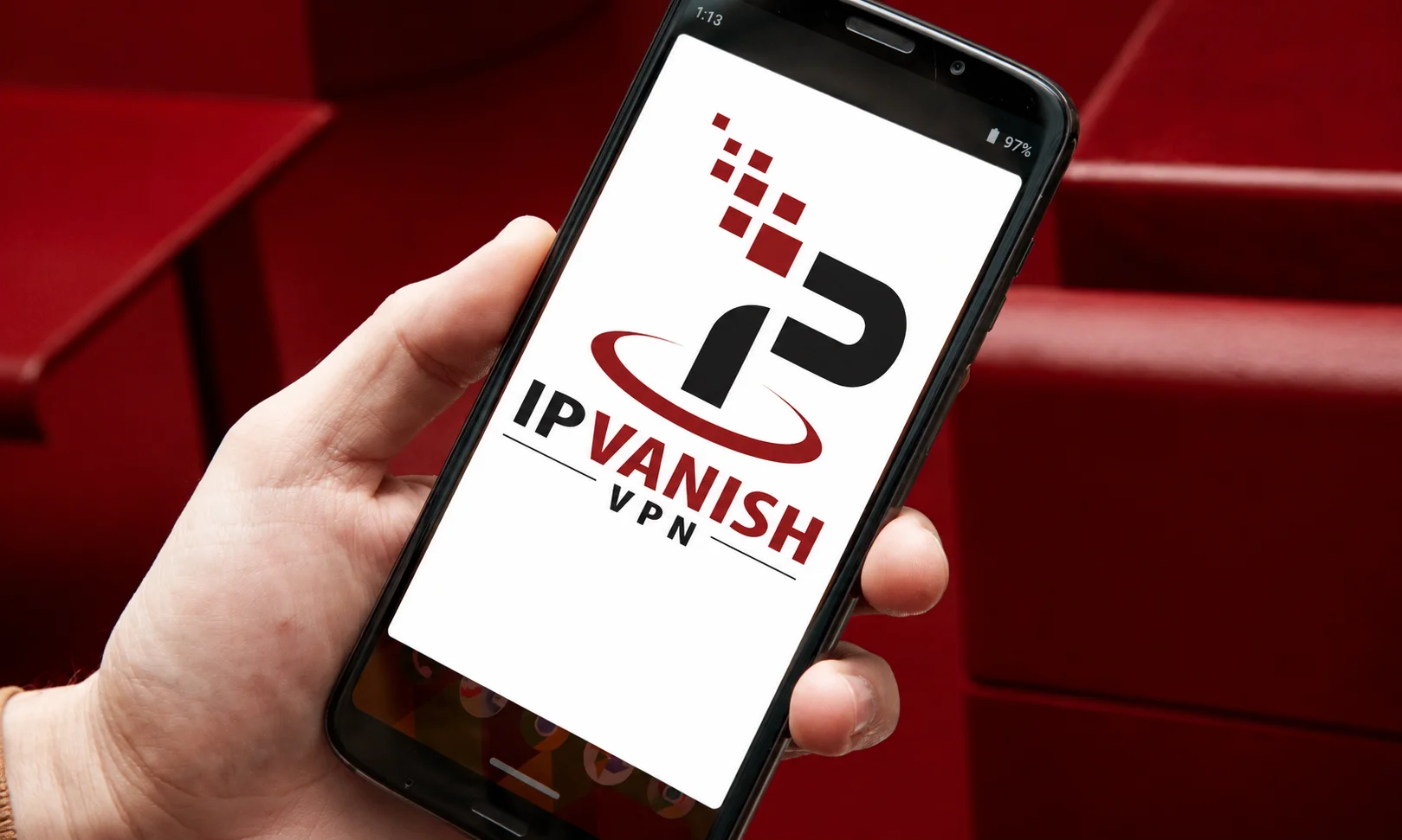 A tablet displaying Proton VPN interface on a dark red desk