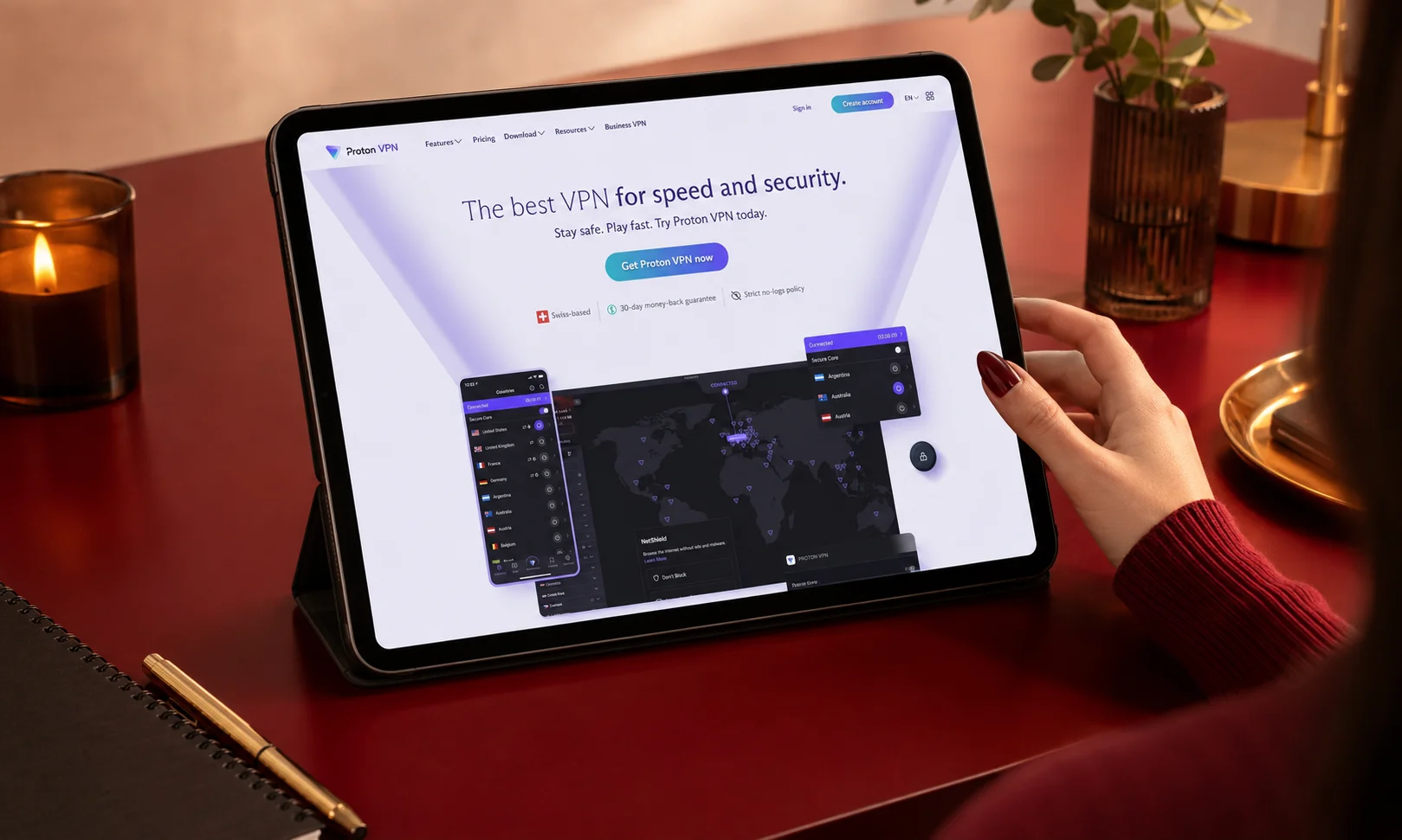 A tablet displaying Proton VPN interface on a dark red desk