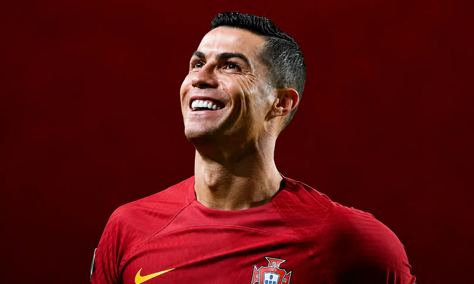 | Messi vs Haaland vs Ronaldo: The Real Numbers After the 2026 World Cup Cristiano Ronaldo looking upwards in a red jersey against a red background