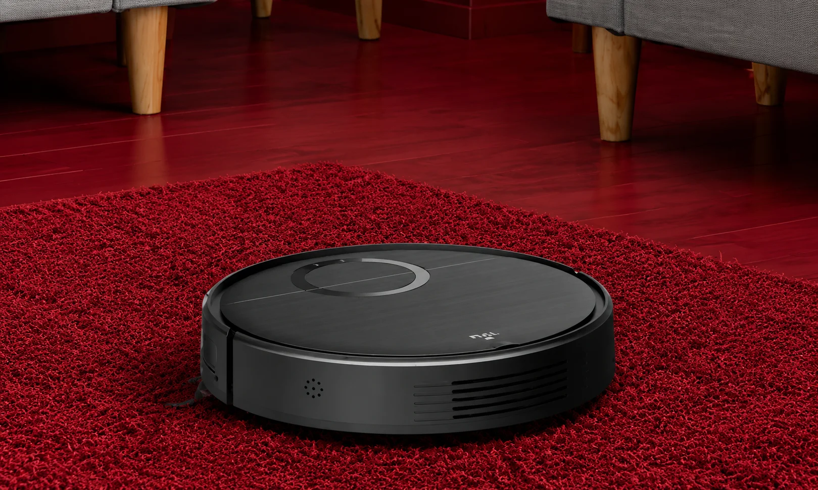 Smart robot vacuum cleaner on floor in a red room