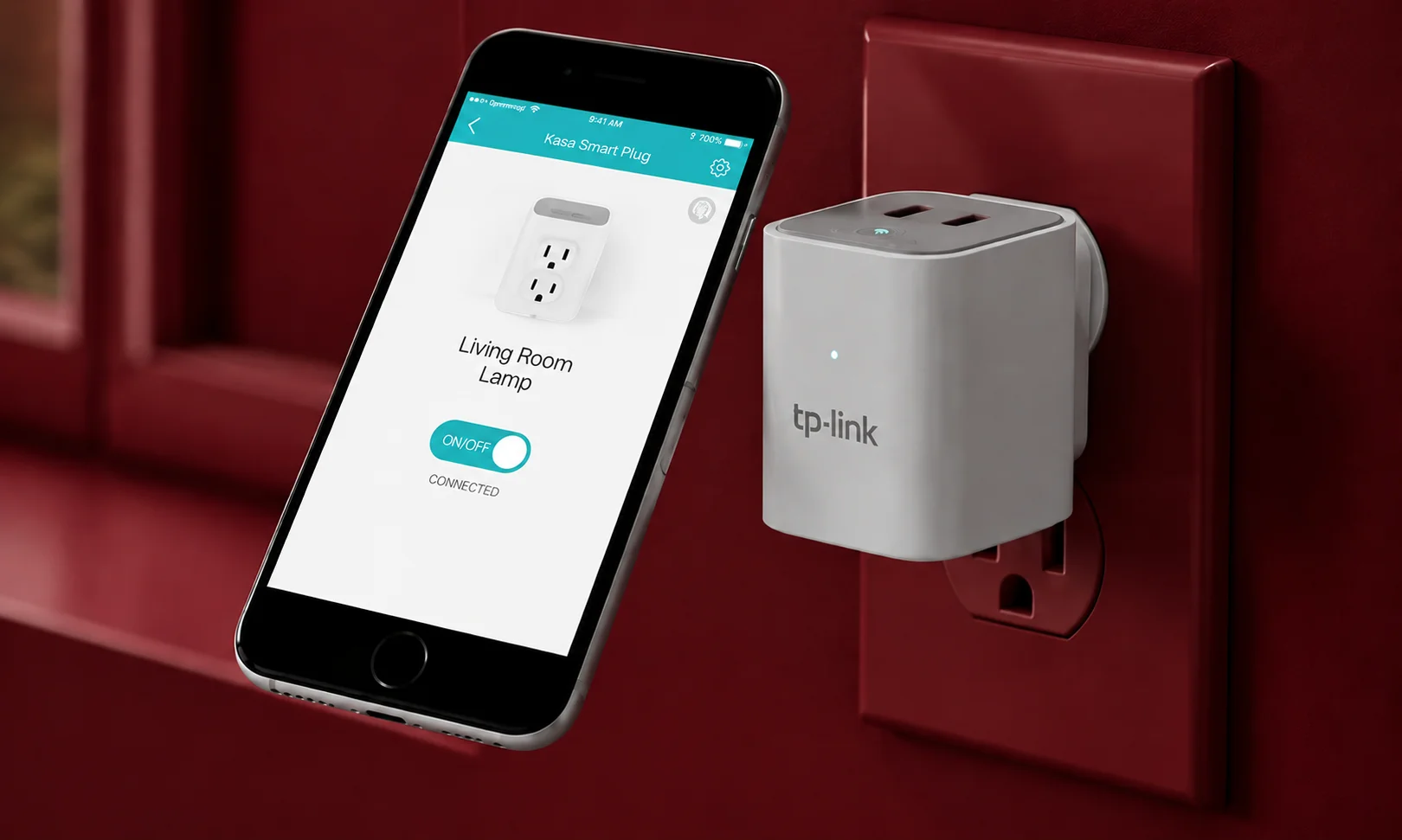 TP-Link Kasa smart plug plugged into wall with phone app