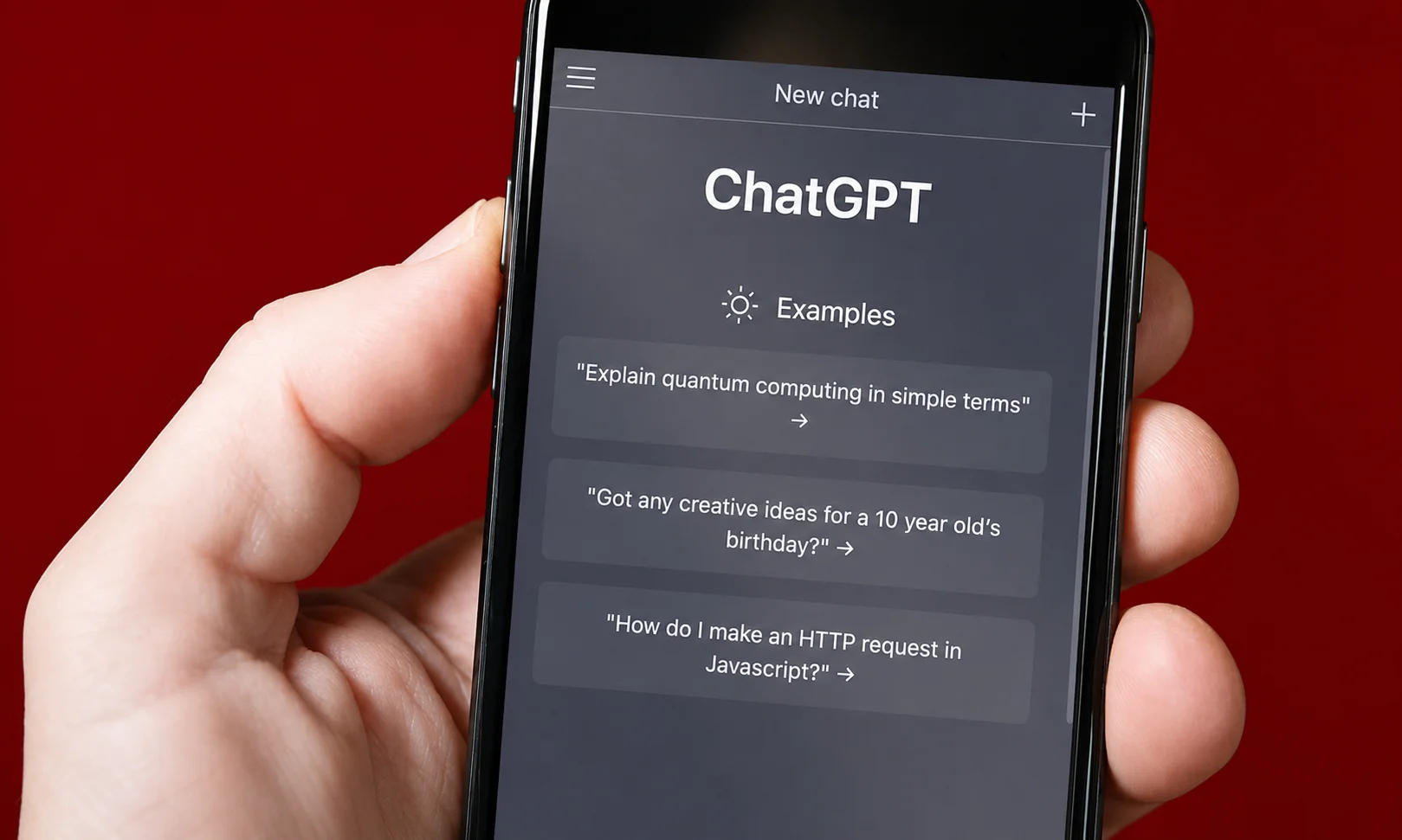 | 15+ Best ChatGPT Prompts (2026): Copy & Paste Templates That Actually Work Hands holding a mobile phone running a chat application on a red backdrop
