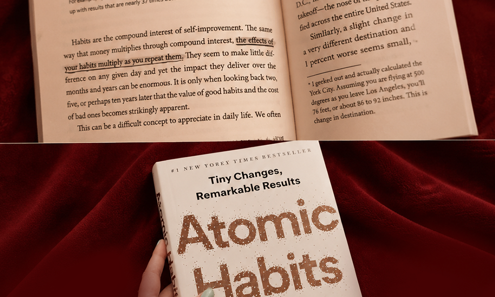 | Atomic Habits Summary: 25 Key Lessons & Actionable Takeaways Open pages of Atomic Habits book by James Clear showing underlined text about compounding interest of self-improvement