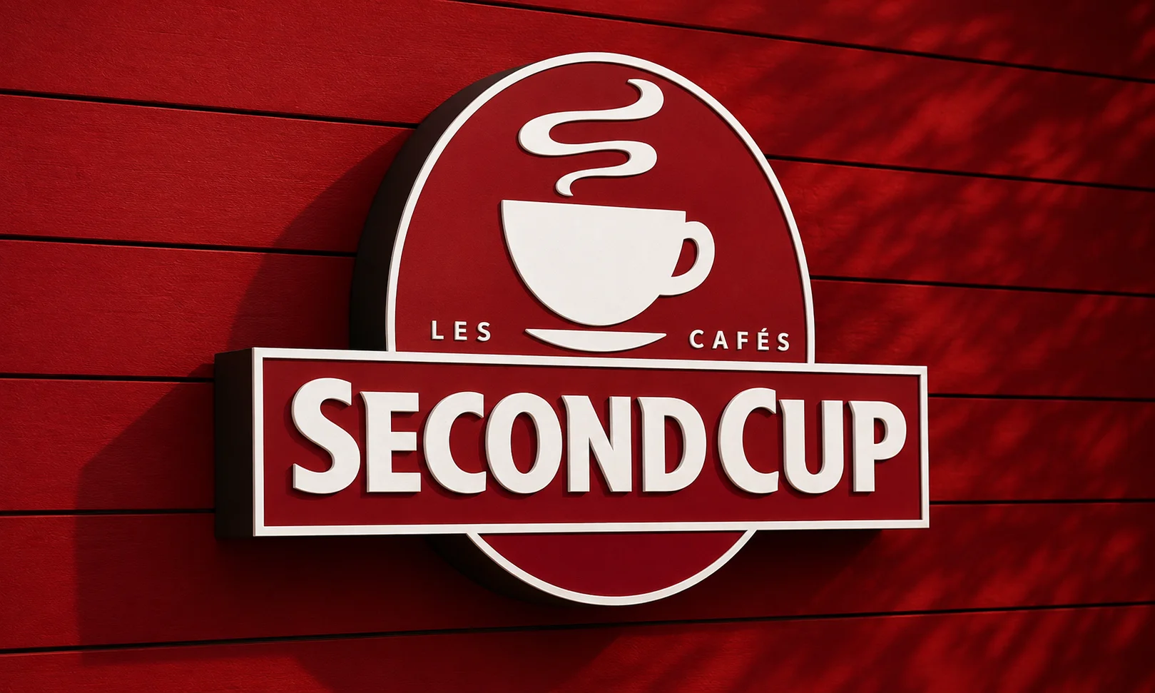 The Second Cup Caf&eacute; logo displayed against a red wooden panel backdrop.