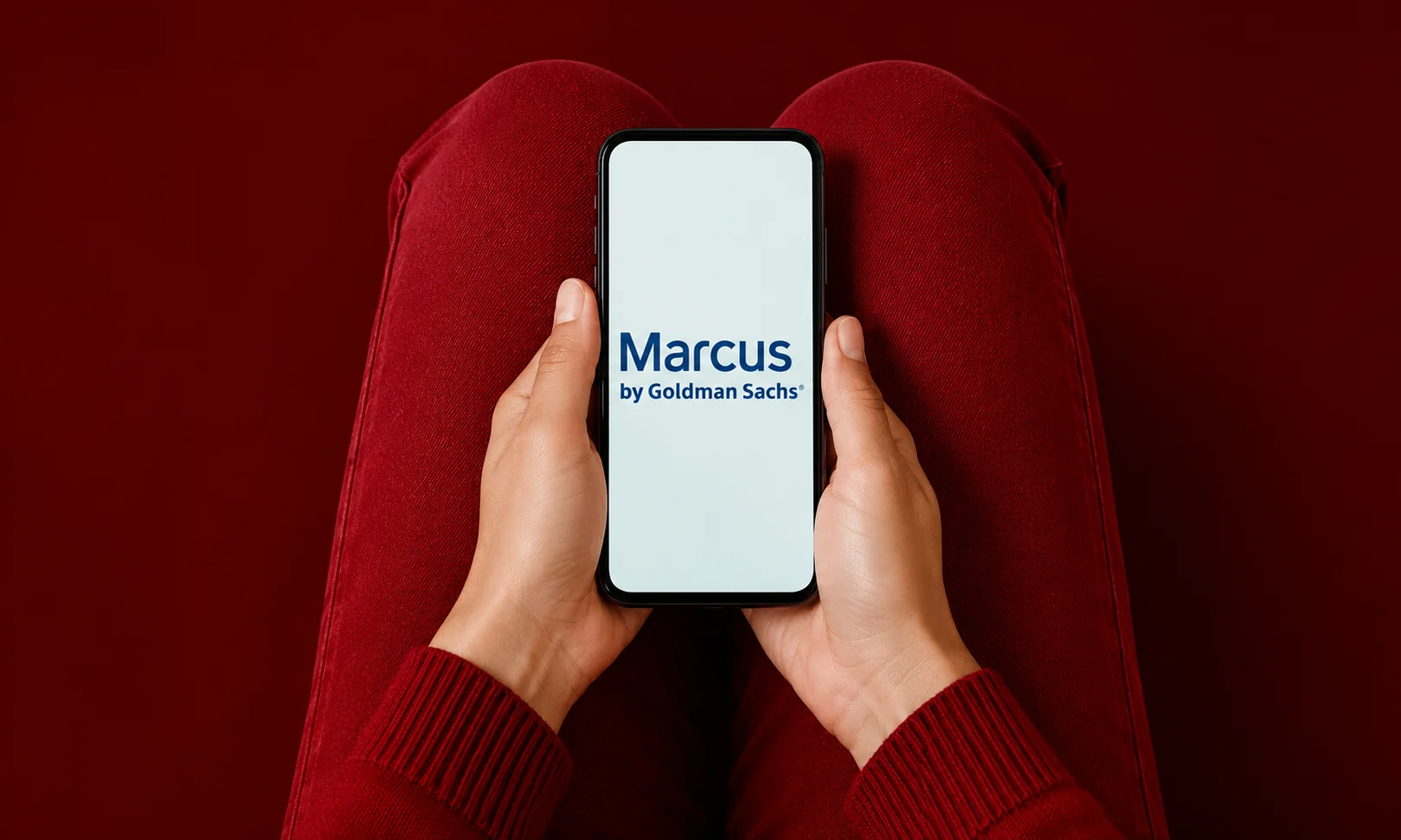 | 15 Best High-Yield Savings Accounts of August 2026 (Up to 4.21% APY) A person using a smartphone with the Marcus by Goldman Sachs app open.