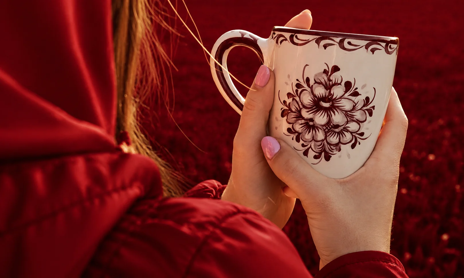 Holding a beautifully crafted ceramic coffee mug