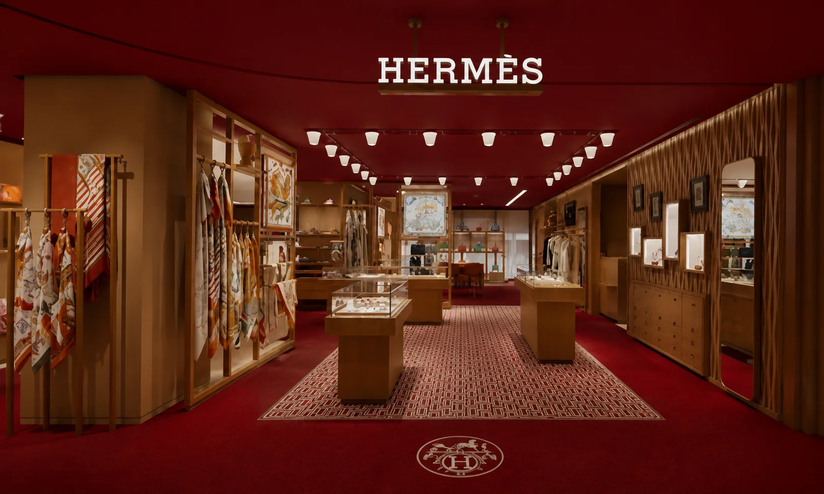 An interior luxury display of Herm&egrave;s products.
