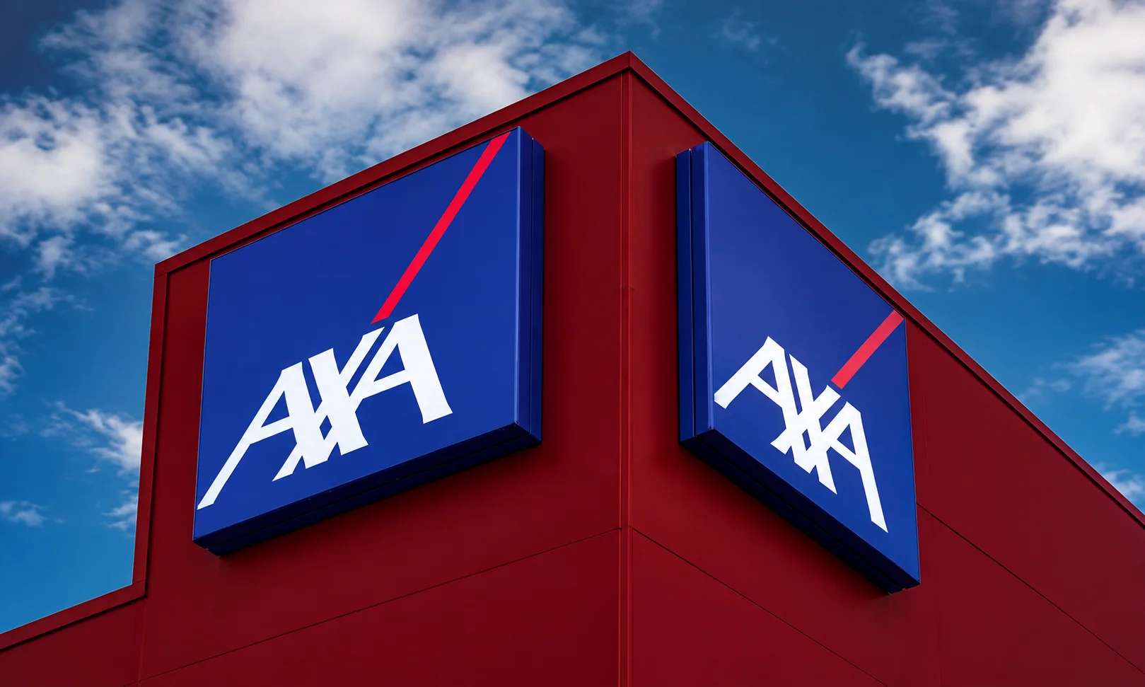 | Best Insurance Companies in the World in 2026 Blue AXA insurance corporate logo signs on the exterior of a modern red commercial building against a blue sky.