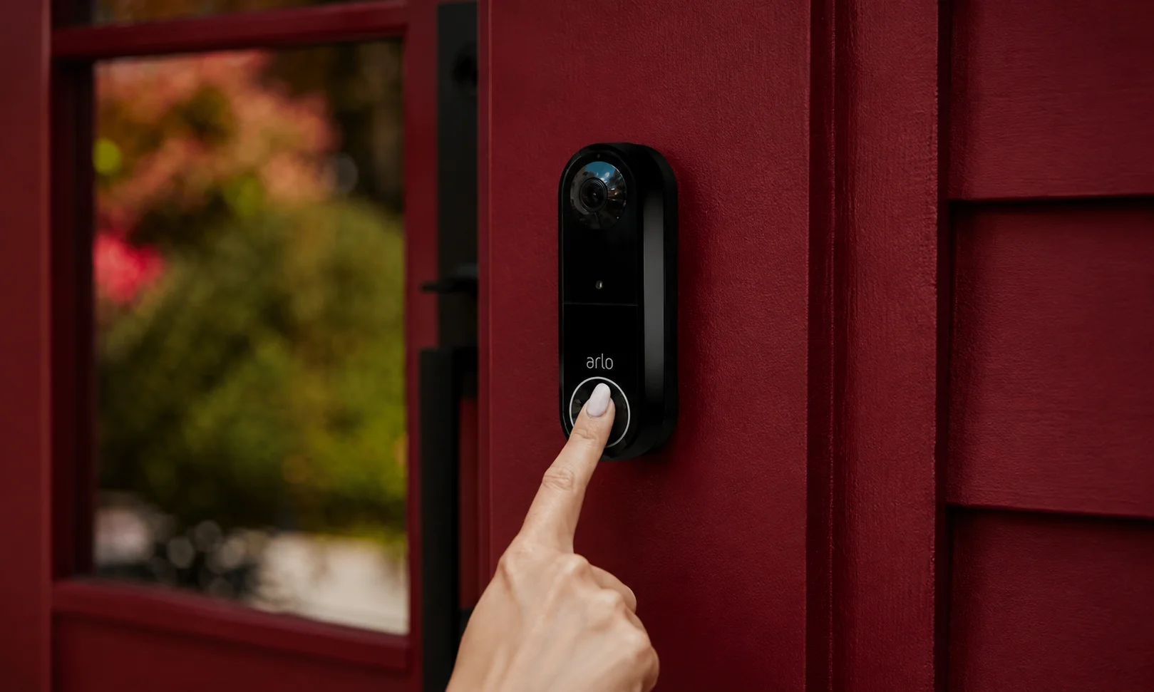 Arlo 2K video doorbell being pressed
