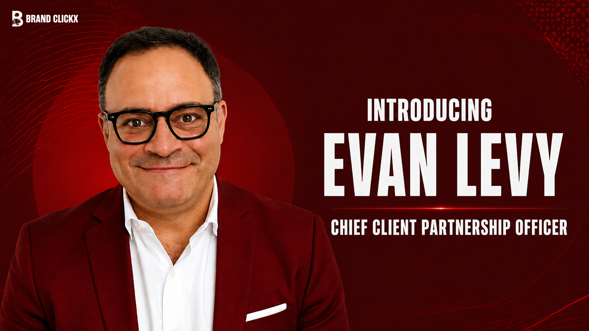 Professional headshot of a man in a blazer with an interview graphic layout on a dark red background