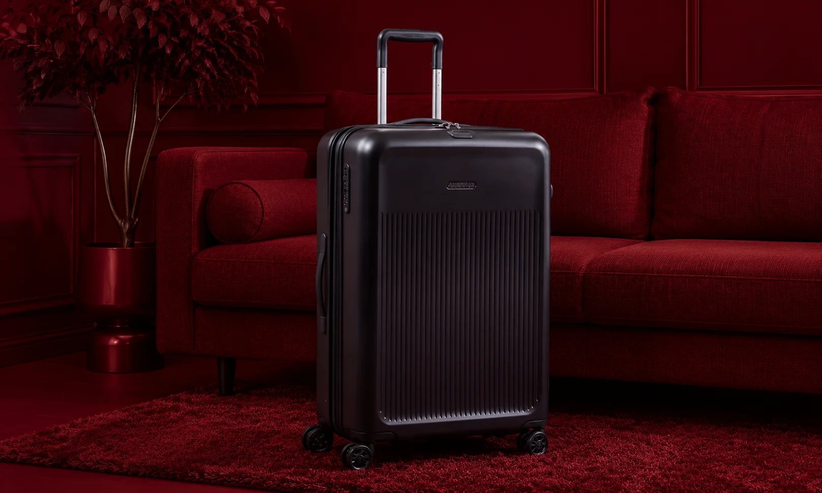 | 15 Best Luxury Luggage Brands for Travelers in 2026 A durable Briggs & Riley suitcase positioned against a deep red interior.